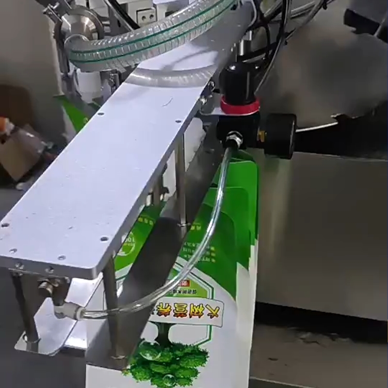 เครื่องบรรจุและปิดฝาอัตโนมัติ รุ่น JSK สำหรับถุงบรรจุแบบมีจุ 23726