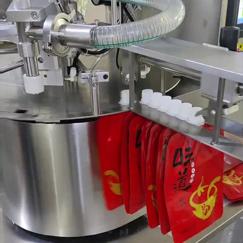 เครื่องบรรจุและปิดฝาอัตโนมัติ รุ่น JSK สำหรับถุงบรรจุแบบมีจุ 23726