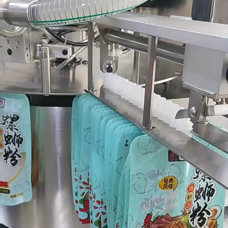 เครื่องบรรจุและปิดฝาอัตโนมัติ รุ่น JSK สำหรับถุงบรรจุแบบมีจุ 23726